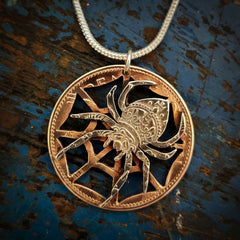 Spider web coin pendant